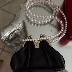 Elegant Black Clutch with Pearl Strap Simon Rocha
